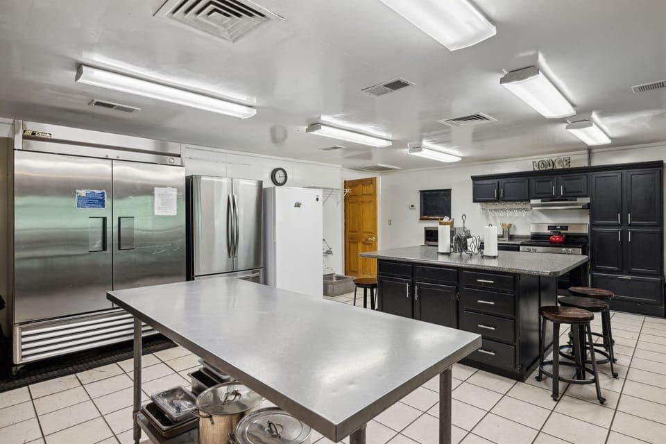 Huge kitchen! 3 fridges/freezers, 2 dishwashers, 2 gas and 1 electric stove.