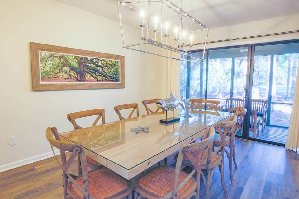 The dining room also features terrific views of the backyard and has sliding door access to the screened porch.