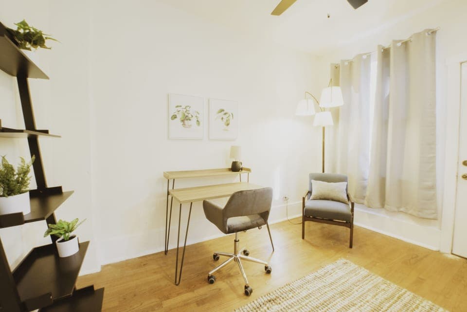 The dedicated workspace has a desk and chair.