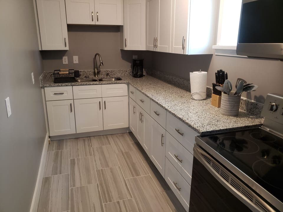 Kitchen with granite countertop.