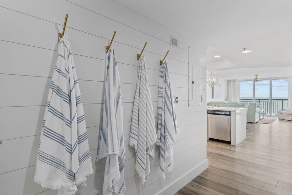 Hooks for beach towels and purses in the hallway
