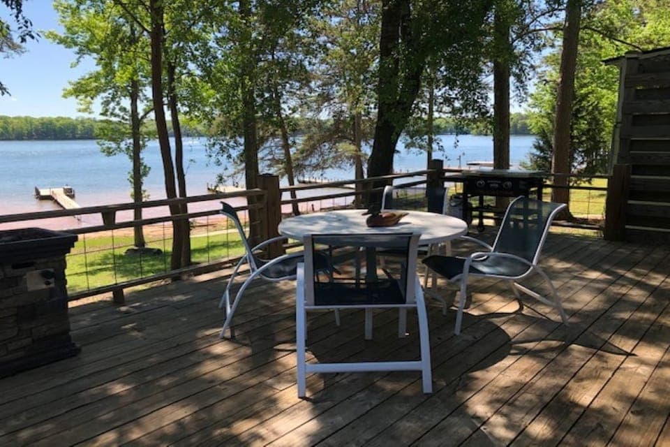 Large deck with two tables and a griddle 
