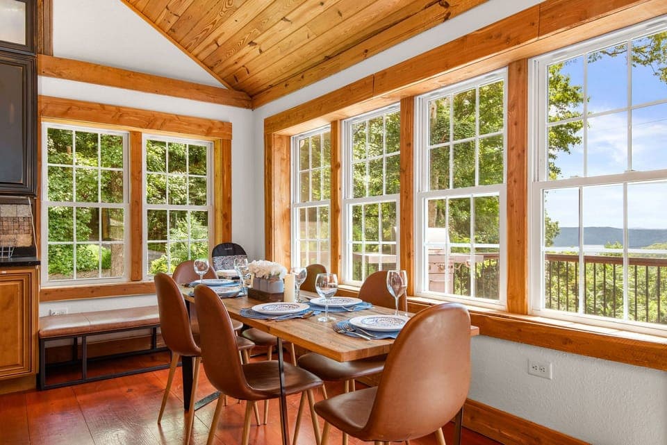 Enjoy eating at the table with gorgeous views and an abundance of light! Child's Highchair also.