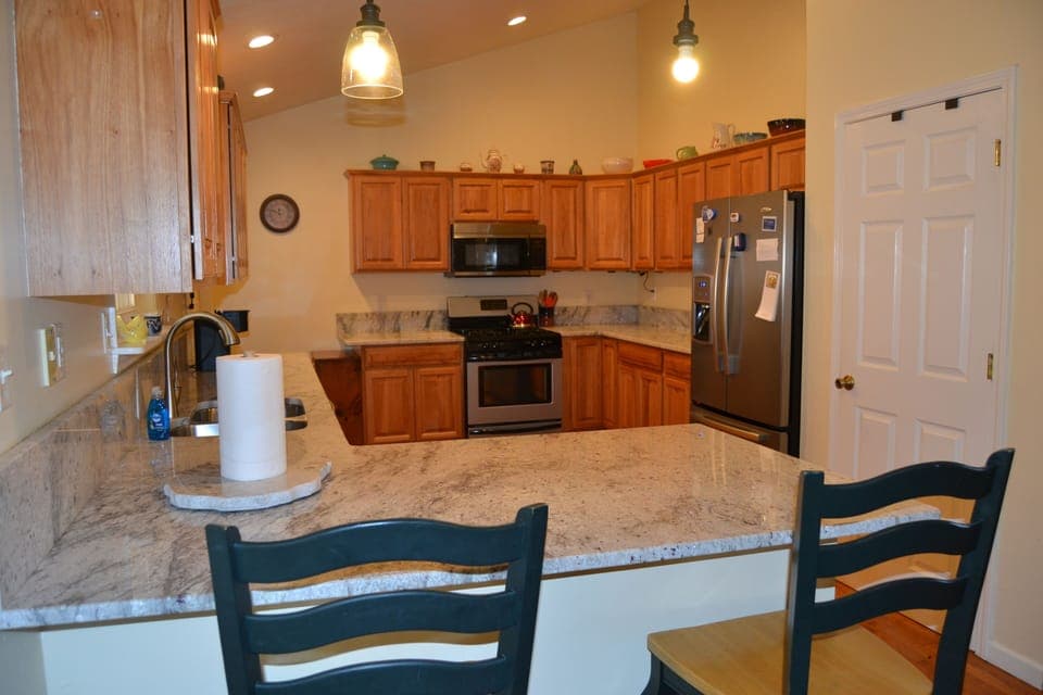 Kitchen view from dining area.  Granite countertops.