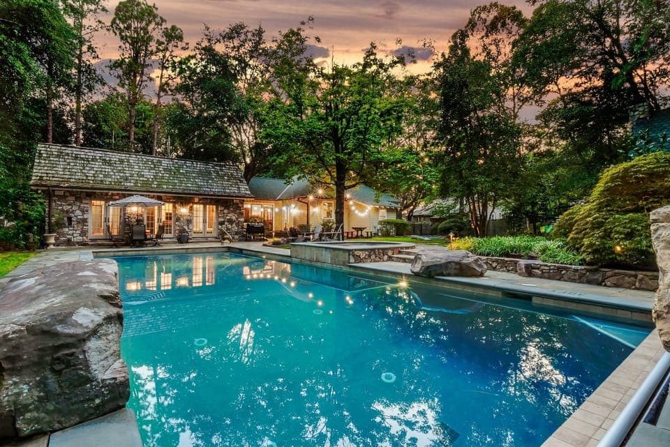 Nestled among lush landscaping, the stunning private pool is the perfect retreat for relaxation and fun.