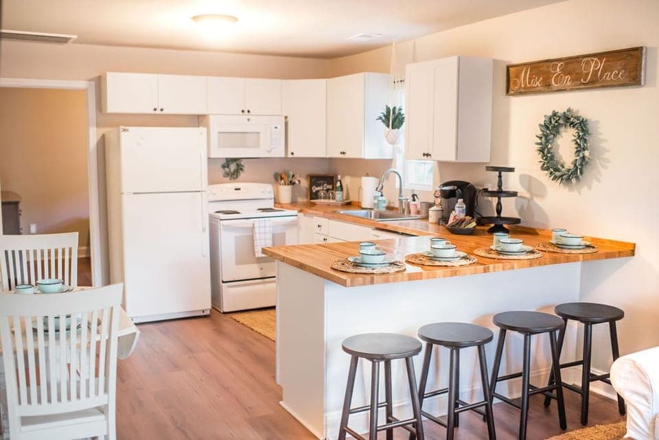 Kitchen with bar and eat-in dining. 
