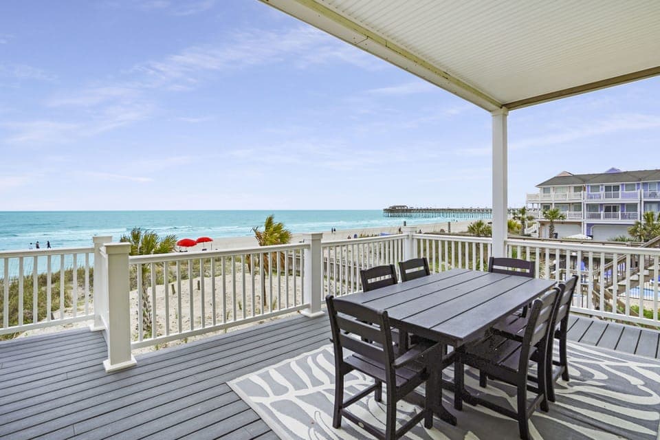 Wake up to stunning ocean views from your private covered deck, where morning coffee tastes better with waves and beach life unfolding below.