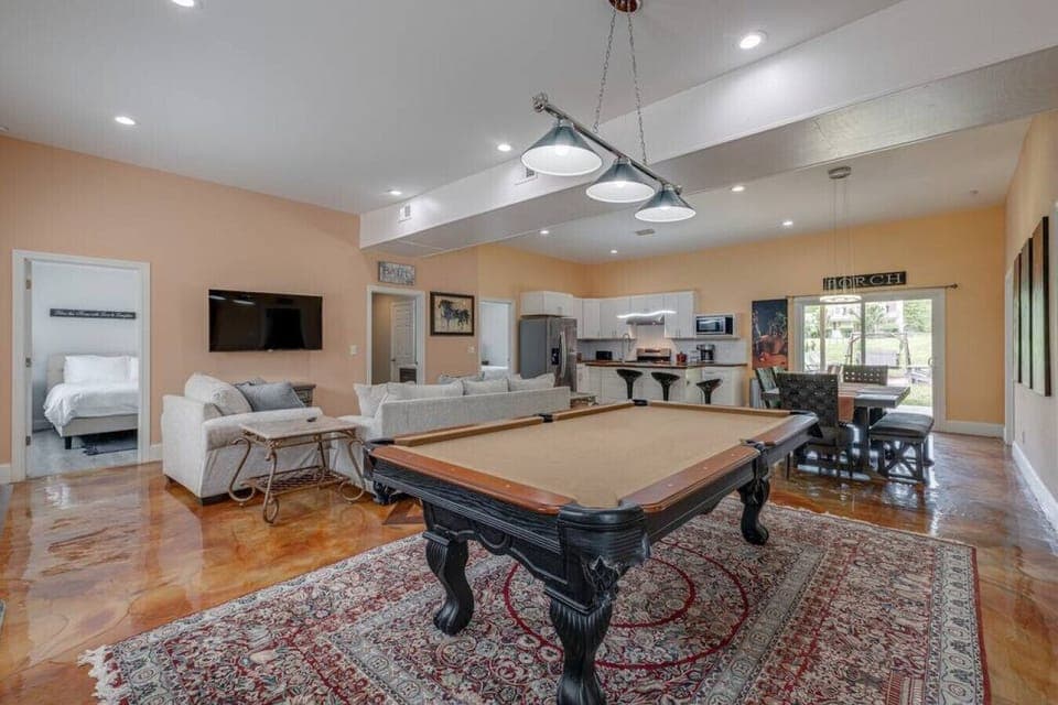 Open concept living area with pool table