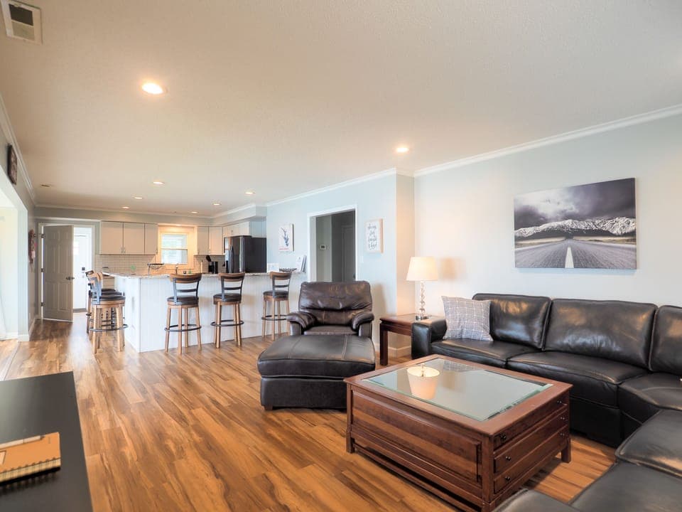 Comfy living area with TV and lake views.