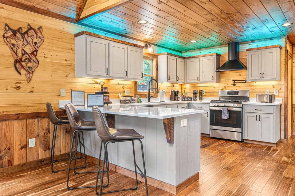 Main level with bar seating and chef's kitchen