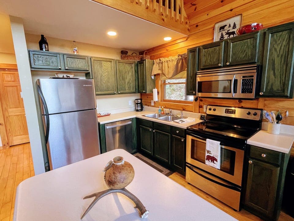 Full kitchen stocked with all of your dining/drinking/cooking/baking needs! 