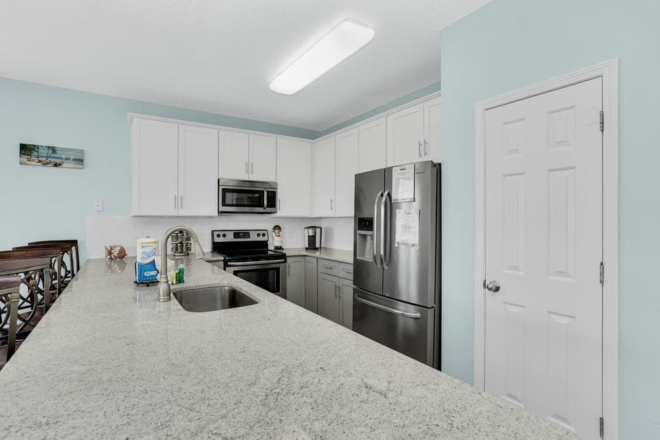 Your fully-equipped kitchen features granite counters, stainless steel appliances, and everything you need to create memorable vacation meals.
