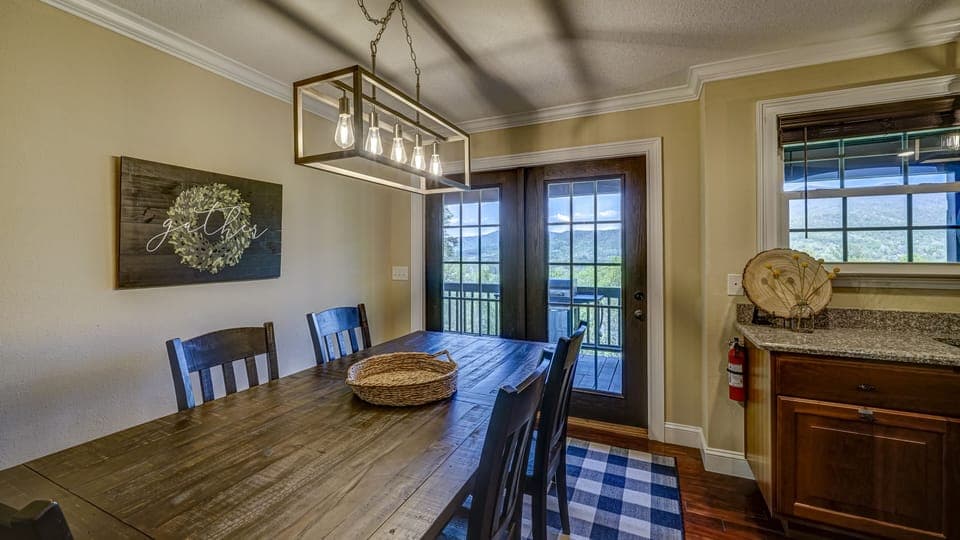 Main level kitchen table for eight 5 on chairs and 3 on bench