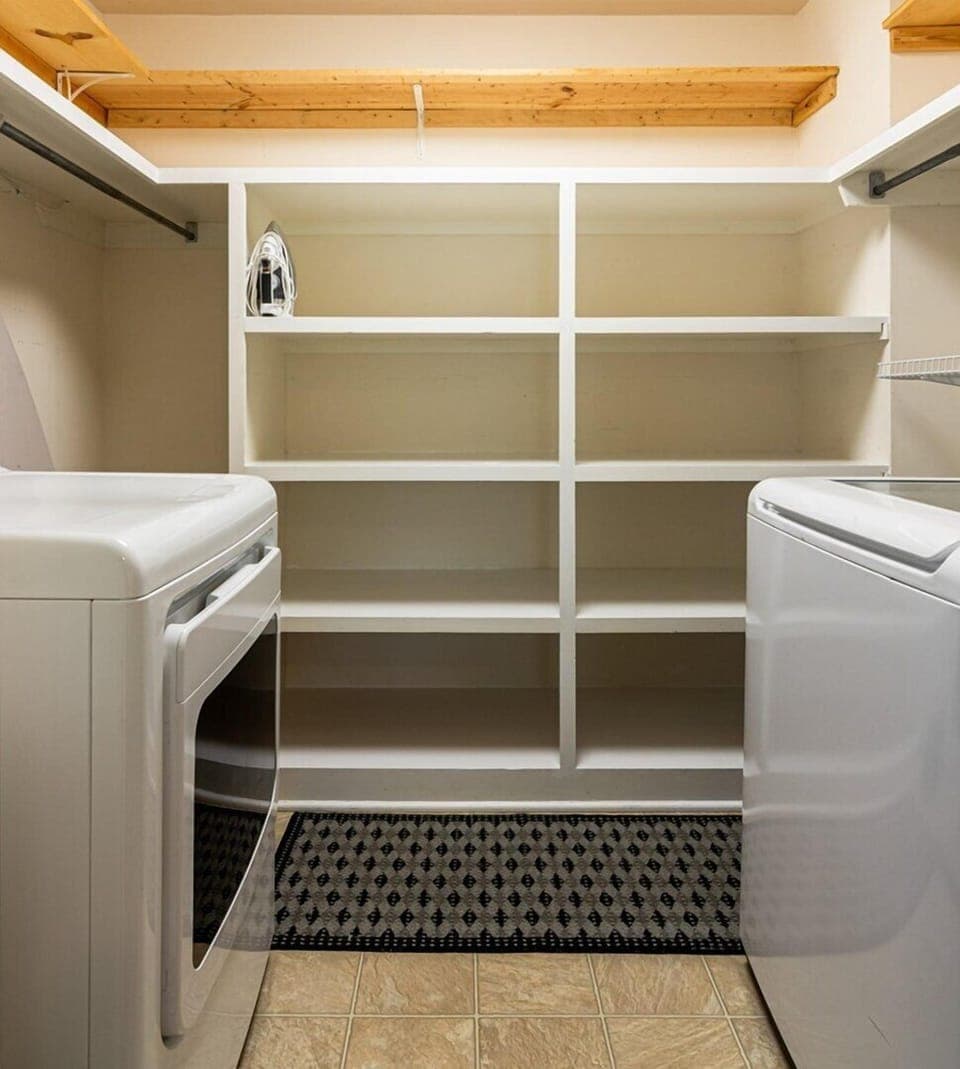 Upstairs closet offers washer and dryer for guests