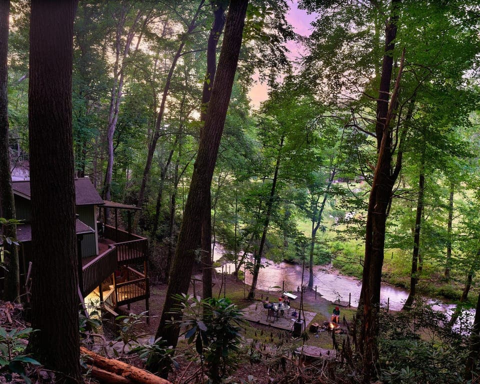 Sunset view from steps to soaking hot tub and rock formation