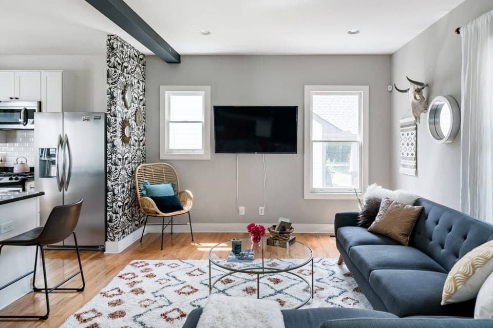 Cozy living room that opens up into the kitchen.