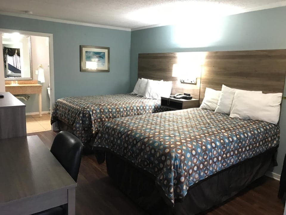 Standard Room, 2 Double Beds | Pillowtop beds, laptop workspace, iron/ironing board, free WiFi