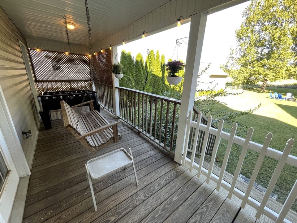 Back deck with swings, Foosball table, and lights 