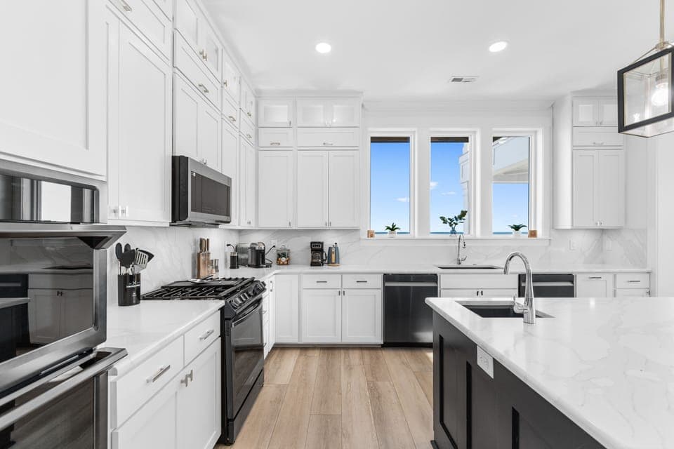 Cook memorable meals in your fully-equipped modern kitchen with granite counters, premium appliances, and bright windows.