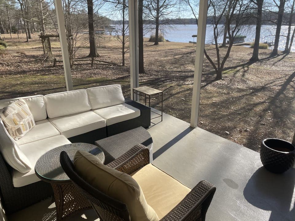 Beautiful screened-in porch w/ sectional & rocking chair, amazing lake views!