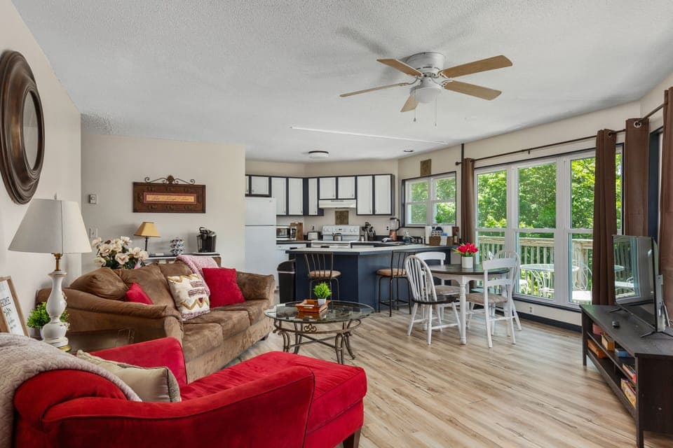 A wall of windows lets in natural light and nature view. Enjoy and unwind! 