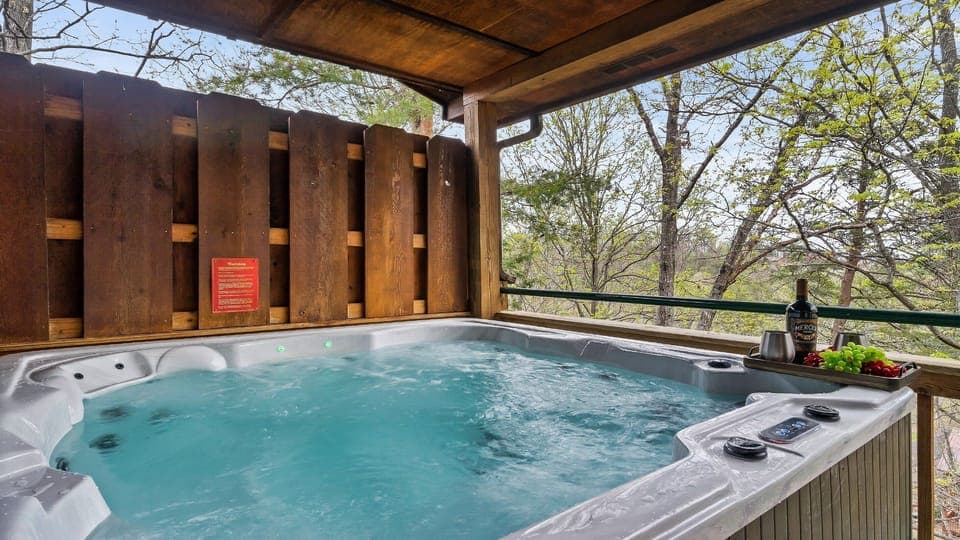 Unwind in your private six-person hot tub on a spacious deck overlooking serene, wooded mountain views. Let the warm jets and peaceful forest backdrop create the perfect end to your day.