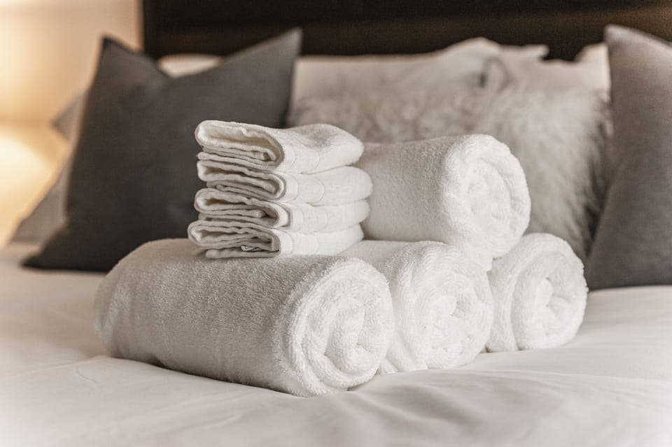 4 towels and 4 wash cloths per bathroom provided.