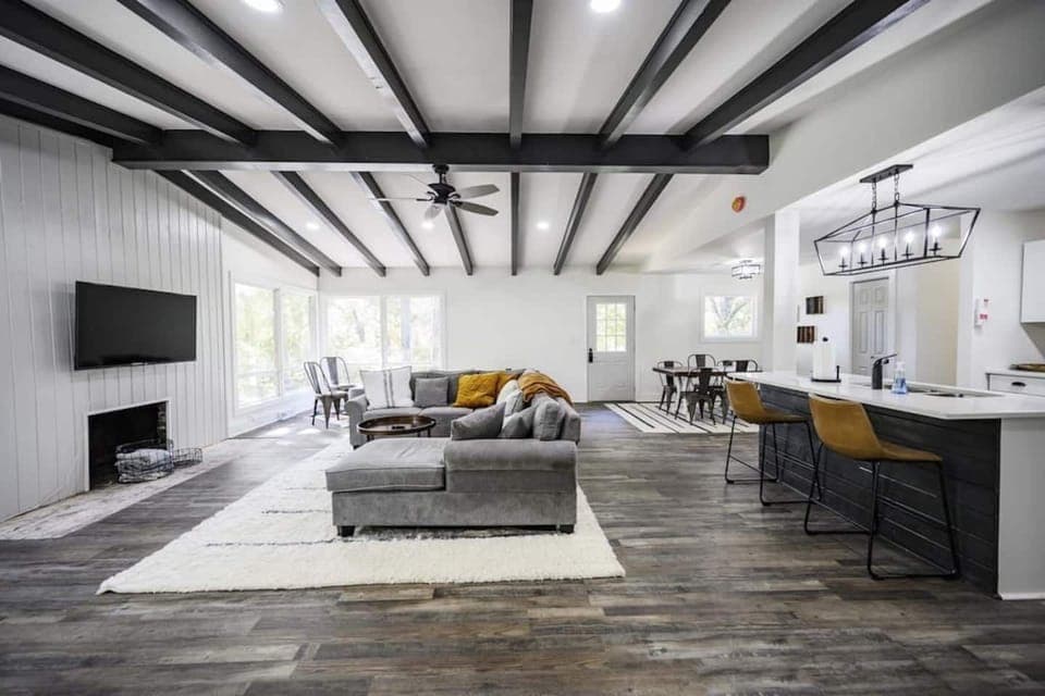 We love how open concept this house is. When renovating the home we knocked down the wall between the kitchen and living room allowing this space to be more luxurious and inviting. 