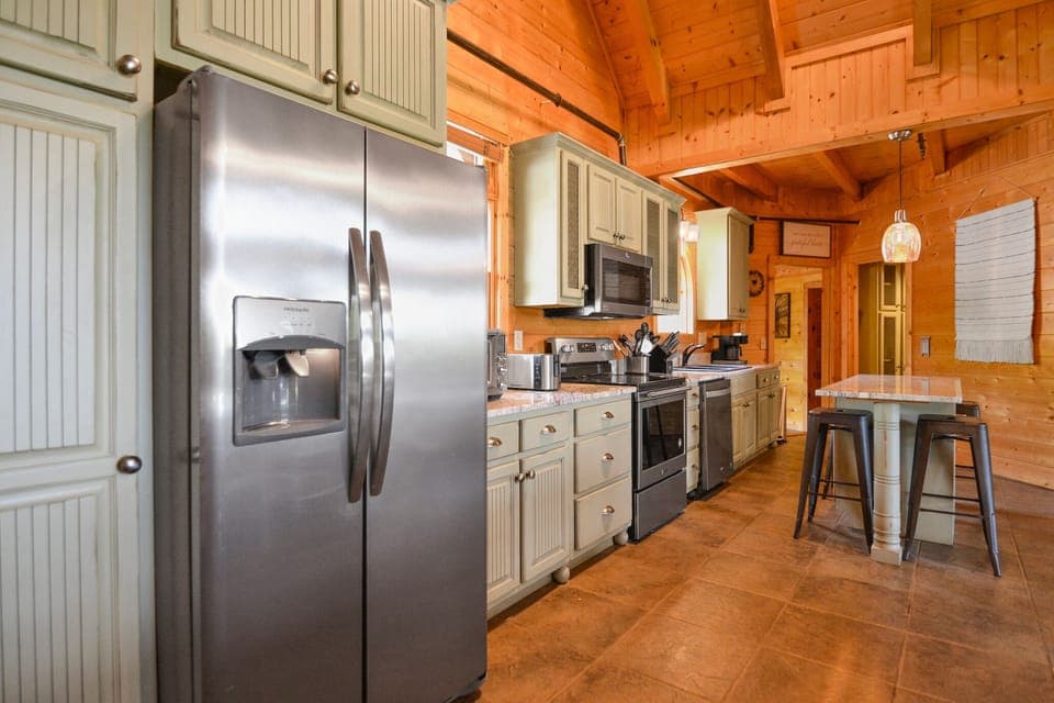 Fully equipped kitchen with stainless steel appliances in luxury Smoky Mountain vacation home.