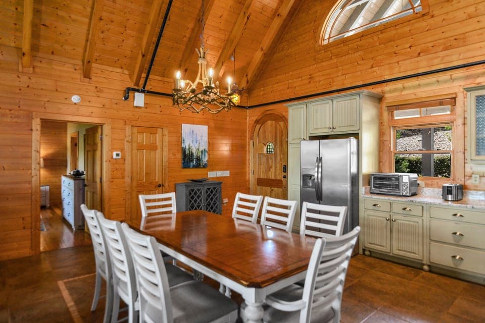 Large dining table perfect for groups in Smoky Mountains cabin with rustic charm.