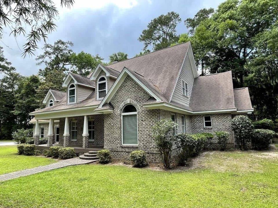 This beautiful brick house sits on over an acre of land on Wilmington Island. 