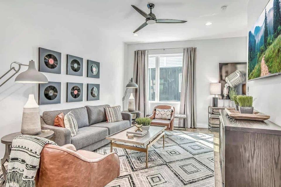 Retro vibes with vinyl art and stylish seating, perfect for relaxation and fun!