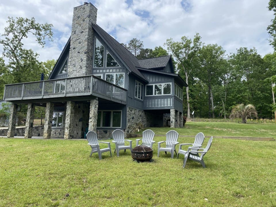 Lovely deck with grill and table up top.  Patio below. Firepit onsite as well