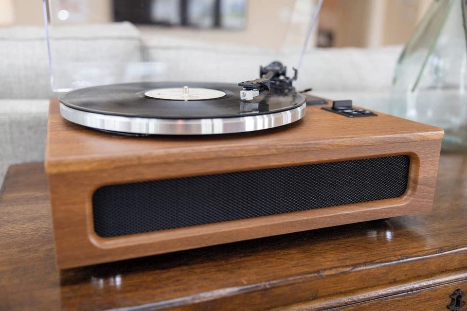 Record player with old records provided for some easy listening with the sound of the waves nearby.