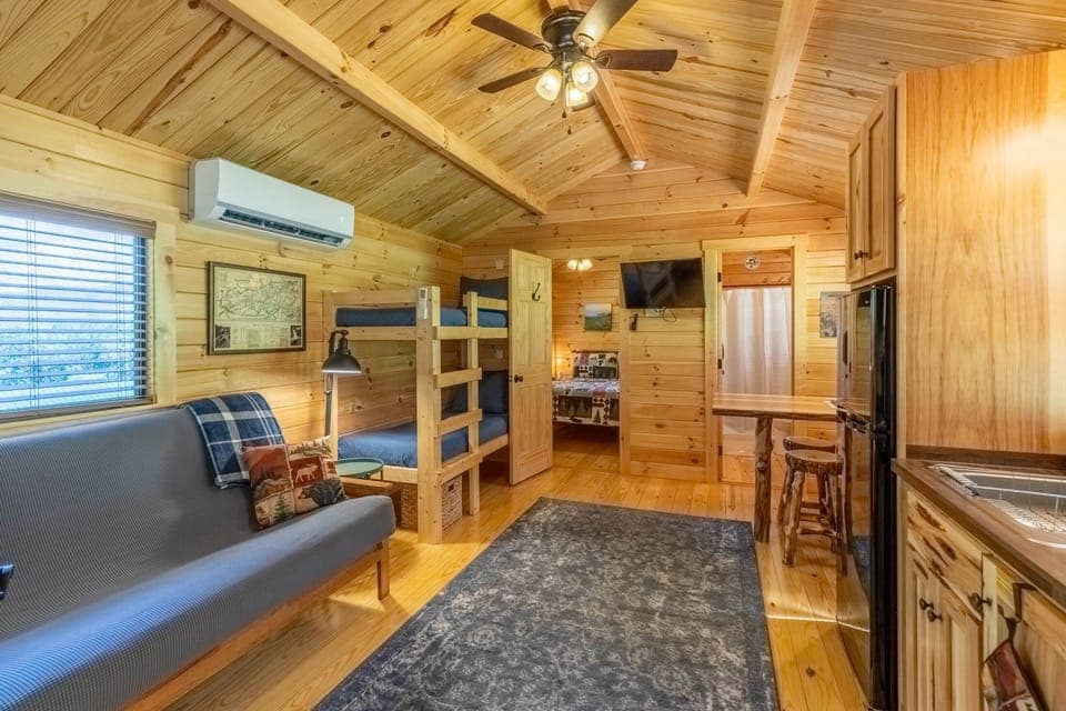 Living and Kitchen Area - Living room with 1 futon, 1 set of bunk beds, and a full kitchen