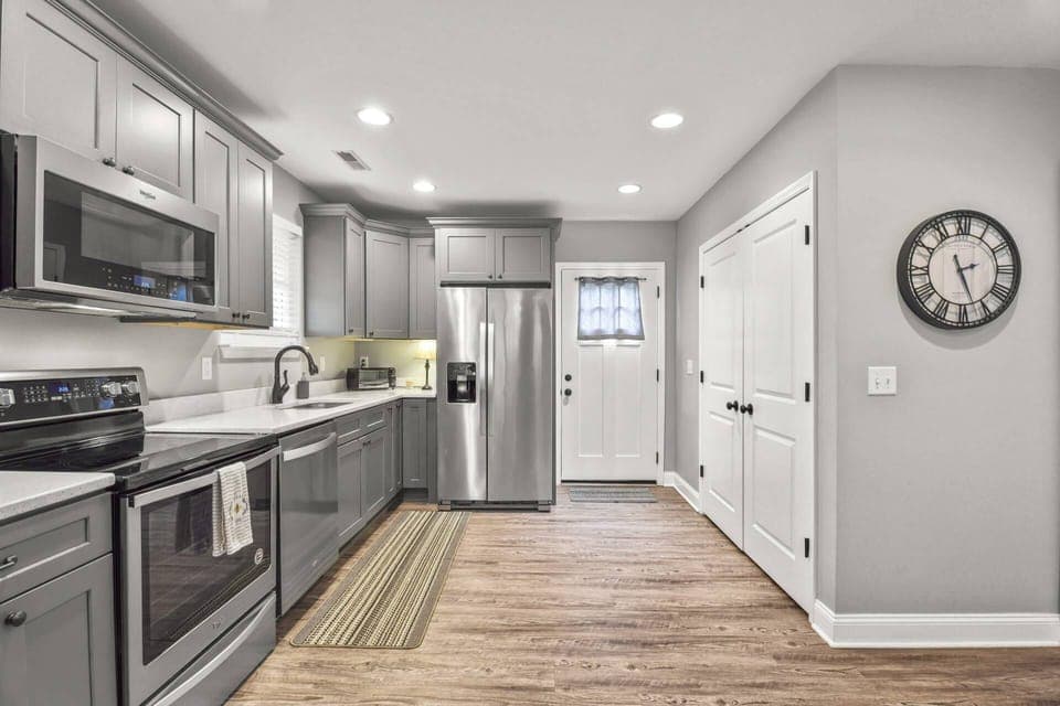 Kitchen opens up to deck and backyard
