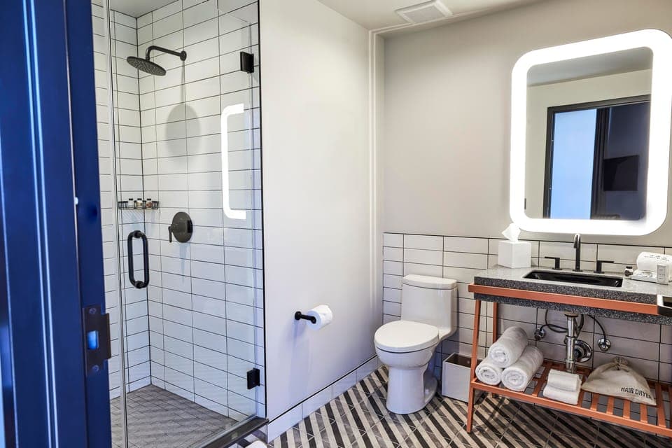 Shower, rainfall showerhead, designer toiletries, hair dryer