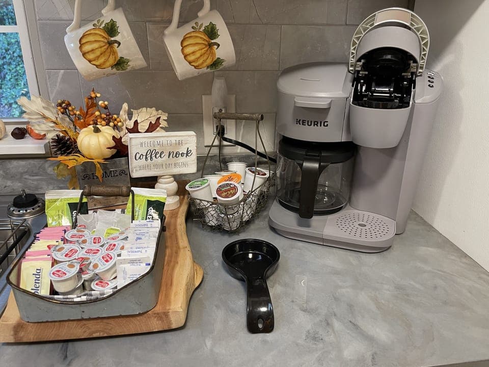Coffee bar. Coffee pods, tea bags, hot chocolate, apple cider-condiments also
