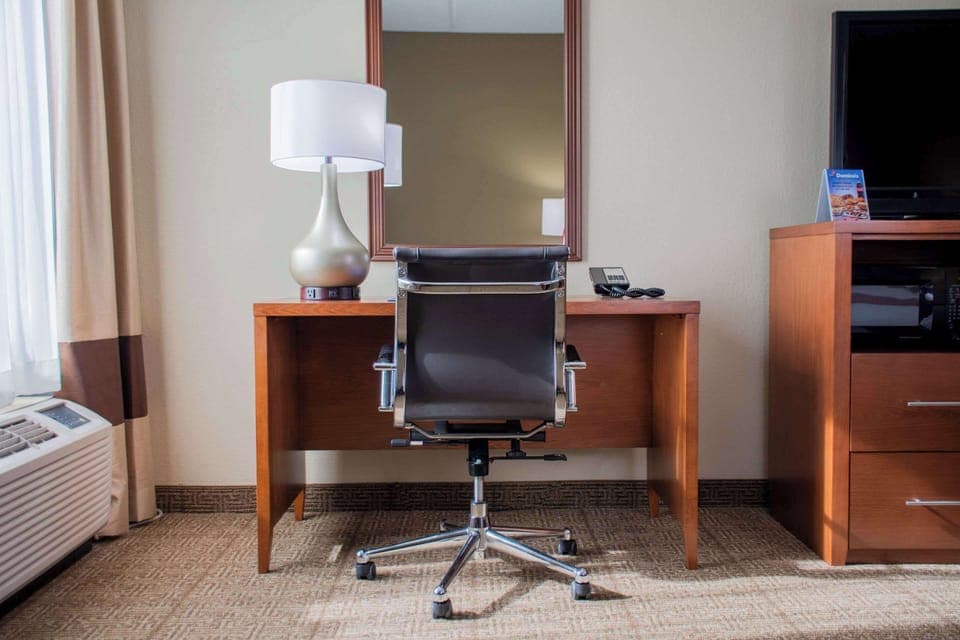 Desk, laptop workspace, blackout drapes, iron/ironing board