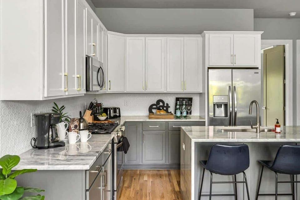 Contemporary kitchen with gray and white tones and spacious island