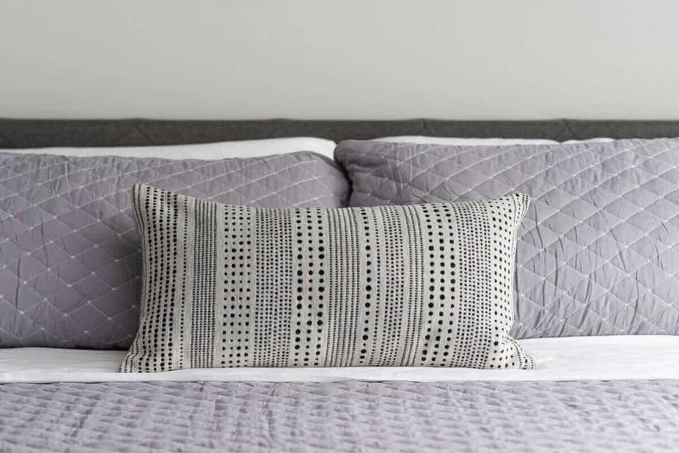 Bedroom 2 - Modern bedroom featuring a gray king bed 