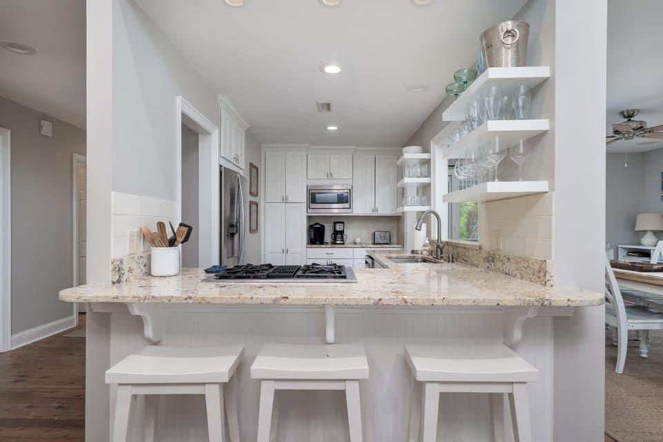 The kitchen has stainless steel appliances, granite counter tops and custom cabinets.  Seating for 3 at the kitchen counter