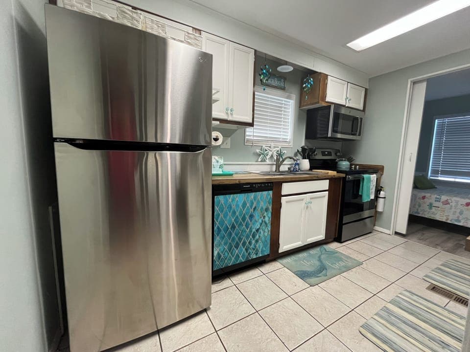 Nicely equipped kitchen stainless steel, crock pot, air fryer, blender and more!