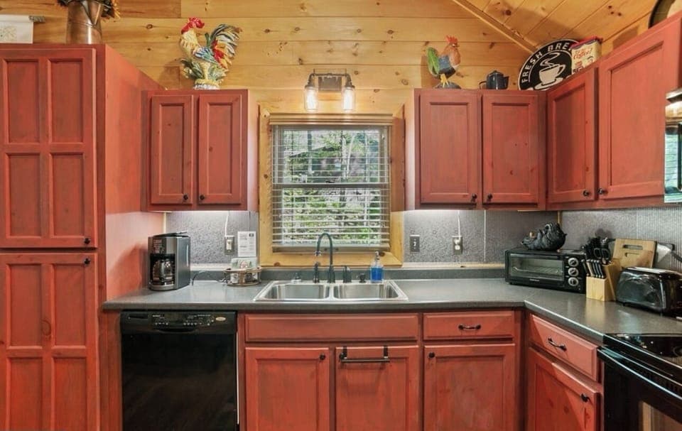 Full kitchen with unique red cabinets