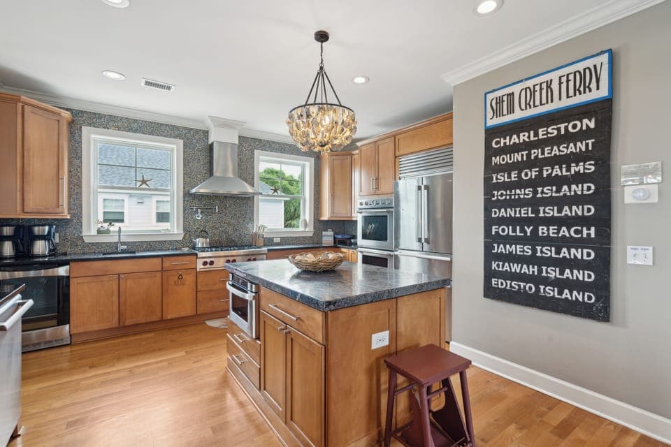 Large kitchen with stainless steel appliances perfect for cooking a meal for friends and family.