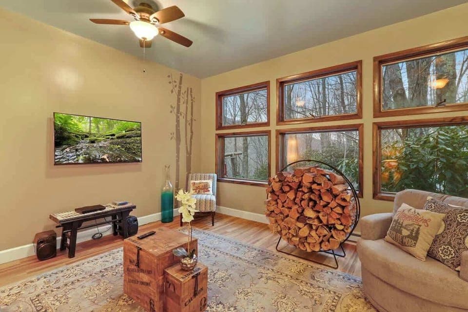 Cozy sophistication: A living room where firewood becomes a stylish accent, seamlessly organized to add warmth and character to the space