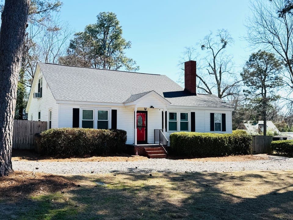 Two Pines - circular driveway, fenced in backyard
