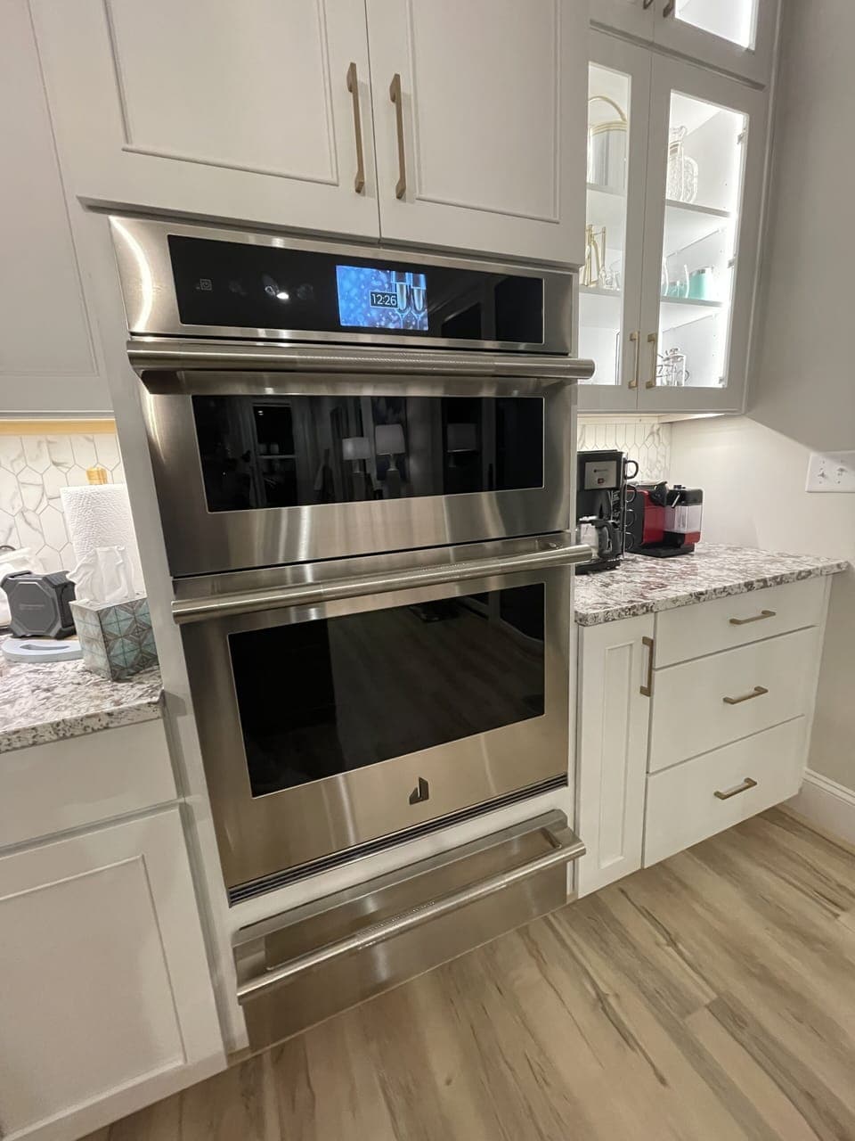 Top of the line JennAir convect/microwave wall oven combo with warming drawer.