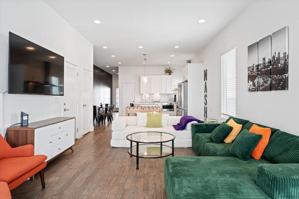 Clean, modern & open living room with seating for the whole group. Large SMART TV with plenty of space to gather without feeling crowded.