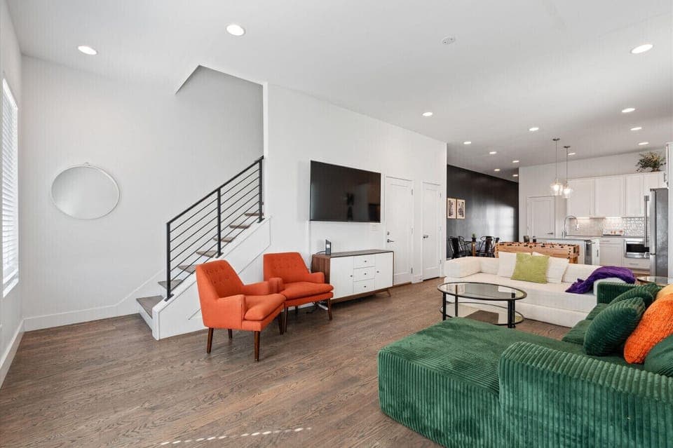 The main hangout space—with a KING sleeper sofa, foosball table, and room for everyone. Whether you`re pregaming or winding down, this is where the group gathers.